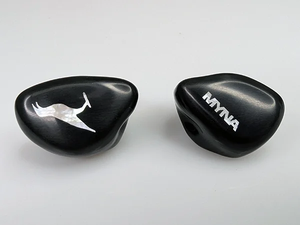 Myna custom-molded IEMs with black faceplates and mother of pearl graphics